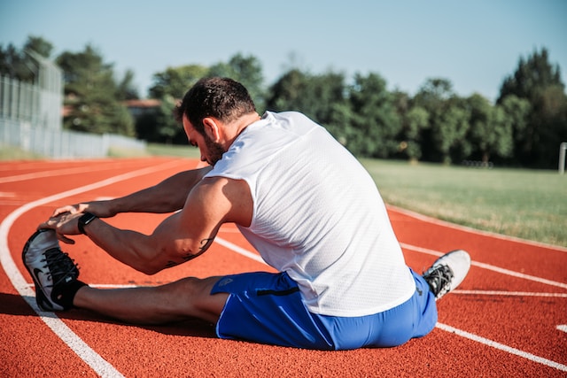 man stretching to prevent injury
